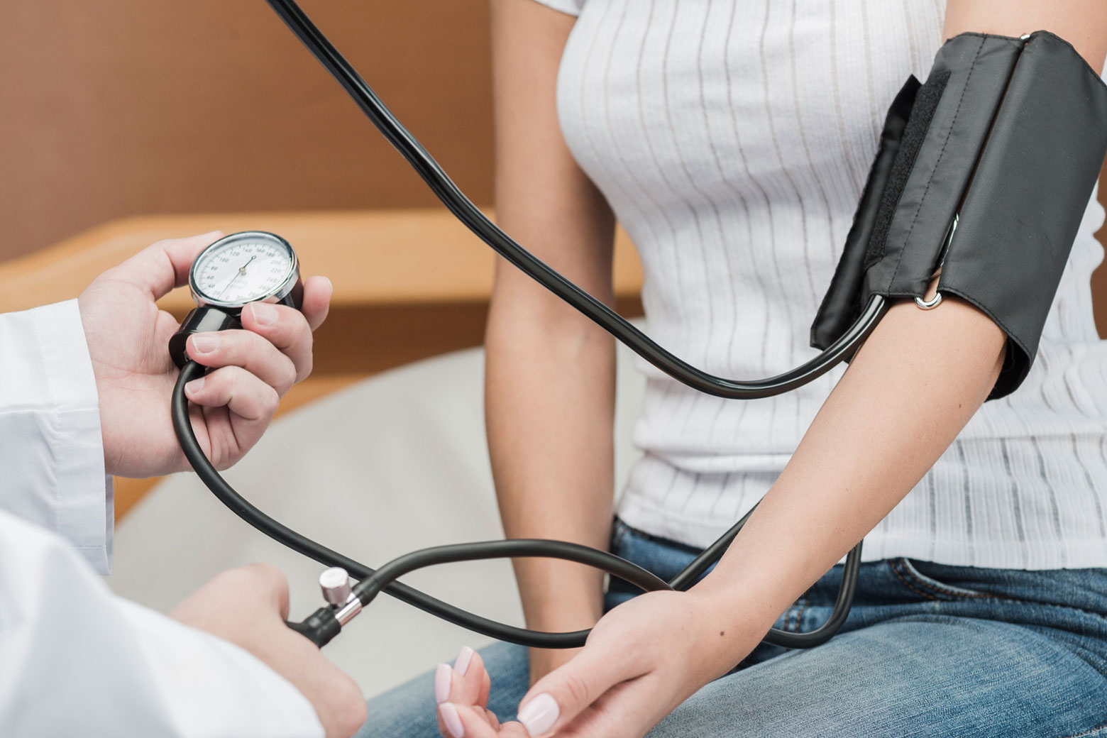 Patient having their blood pressure measured in a doctor's office